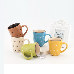 Embossed mug with dots painted