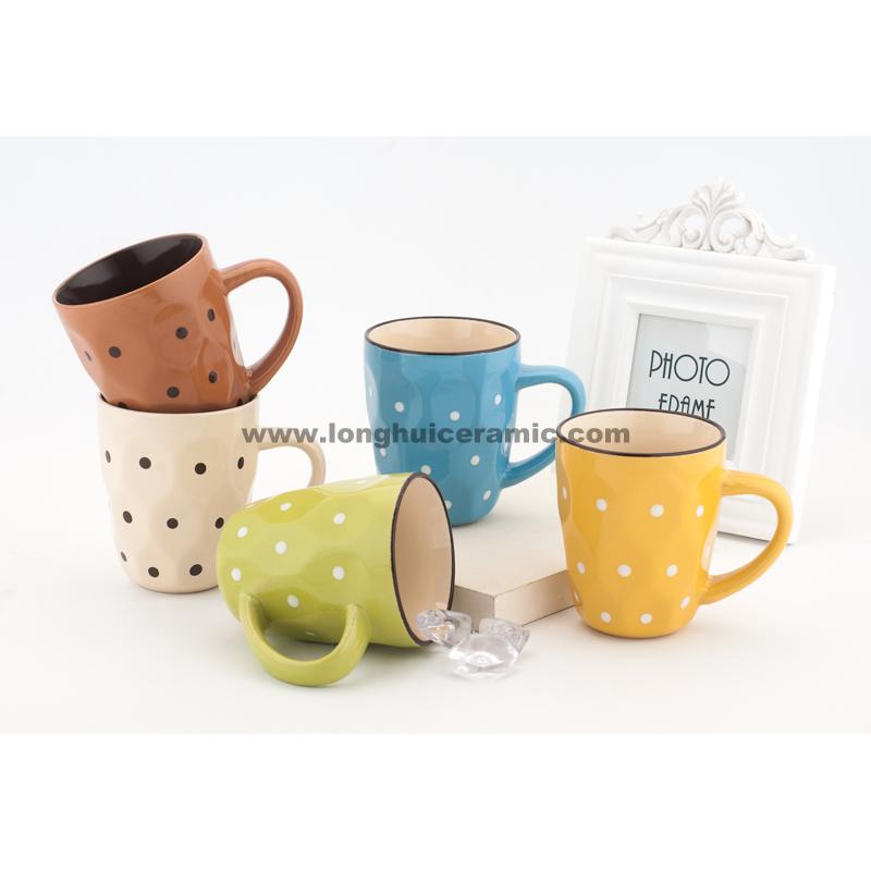 Embossed mug with dots painted
