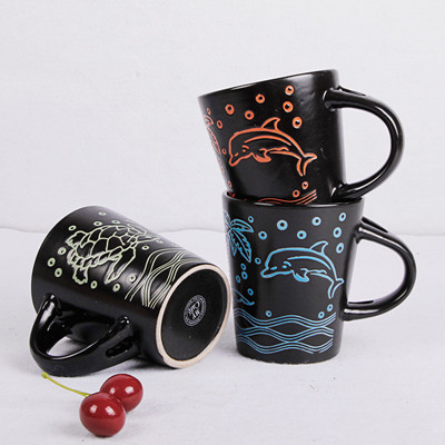 Black porcelain mug with stick figures